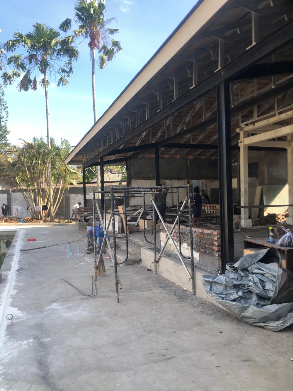 A side view of a plate of figs and berries. 